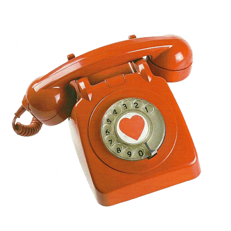A red rotary phone with a hear in the middle of the dial.